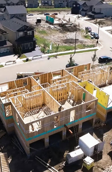 Aerial view of building being framed.