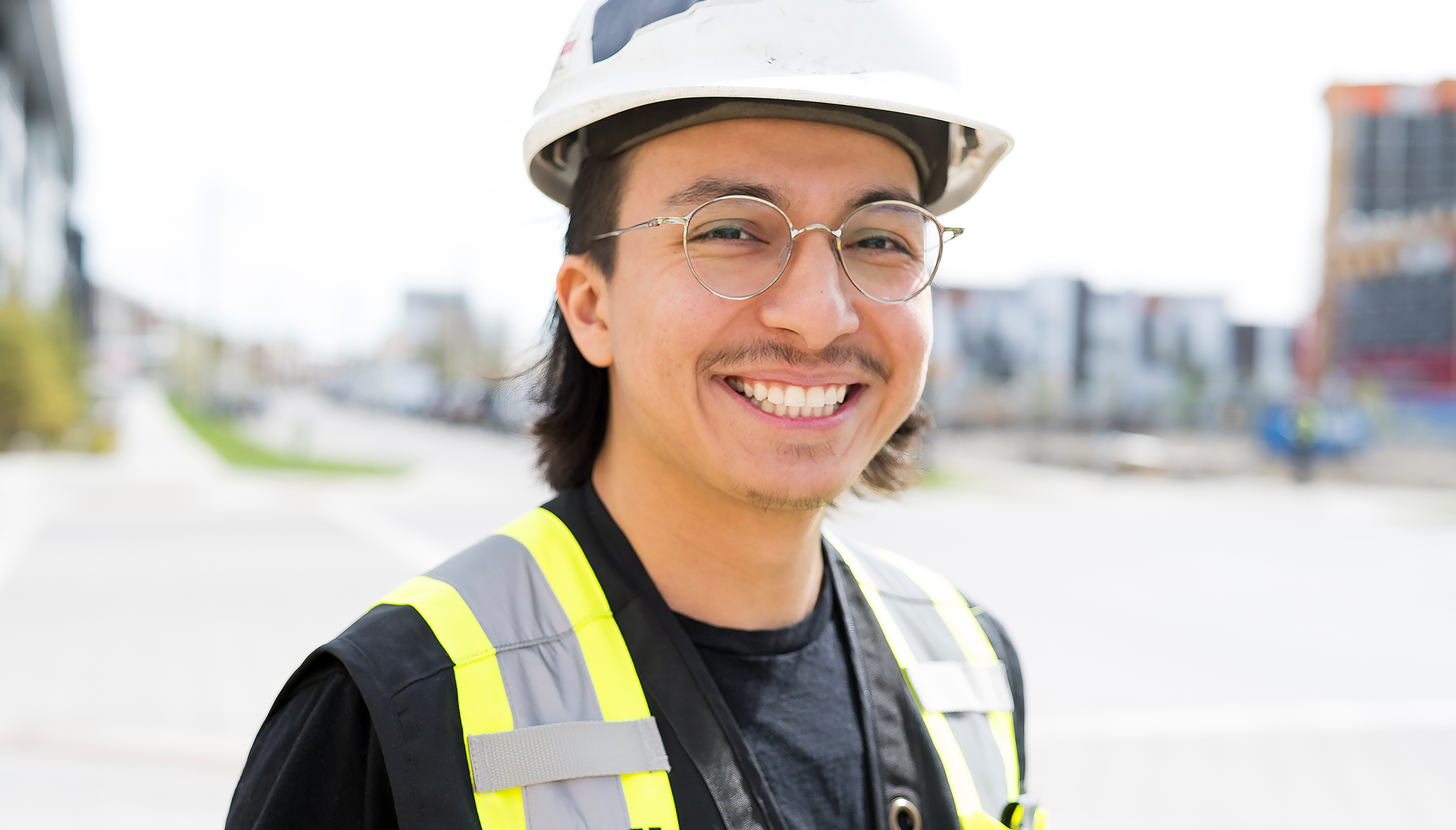 Photo of construction worker with a big smile.